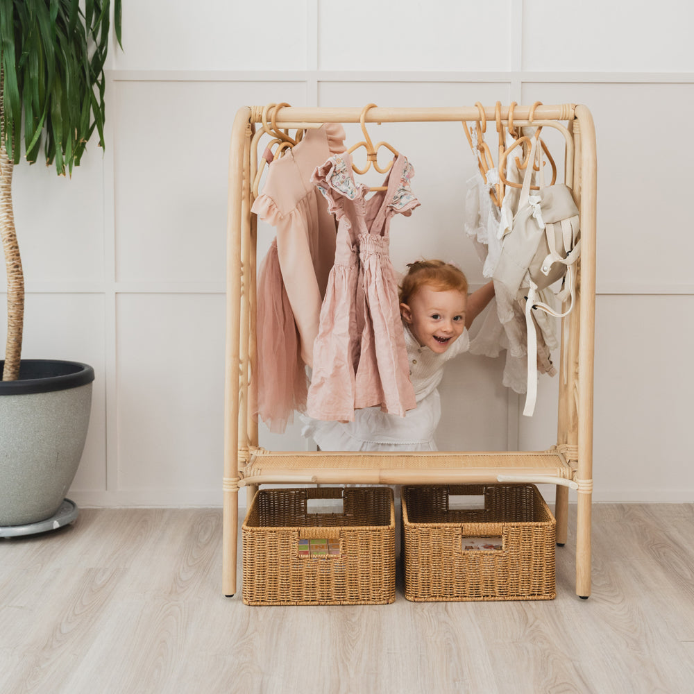 Rattan Clothing Rack | Toddler Girl Playing behind Belle Kids Clothing Rack | MOMIJI