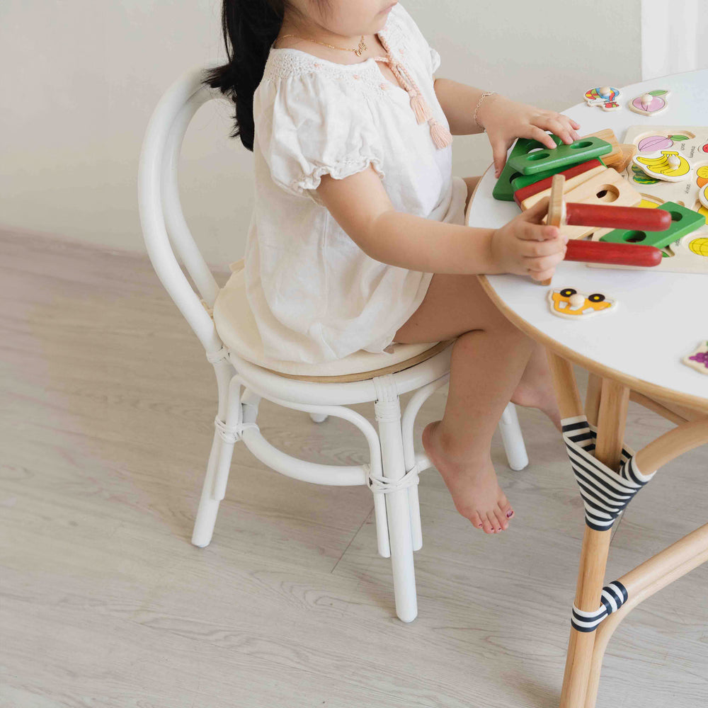 Rattan Chair | Aulia Kids Chair - White | with Cushion | Child sitting on kid's chair and playing |  MOMIJI